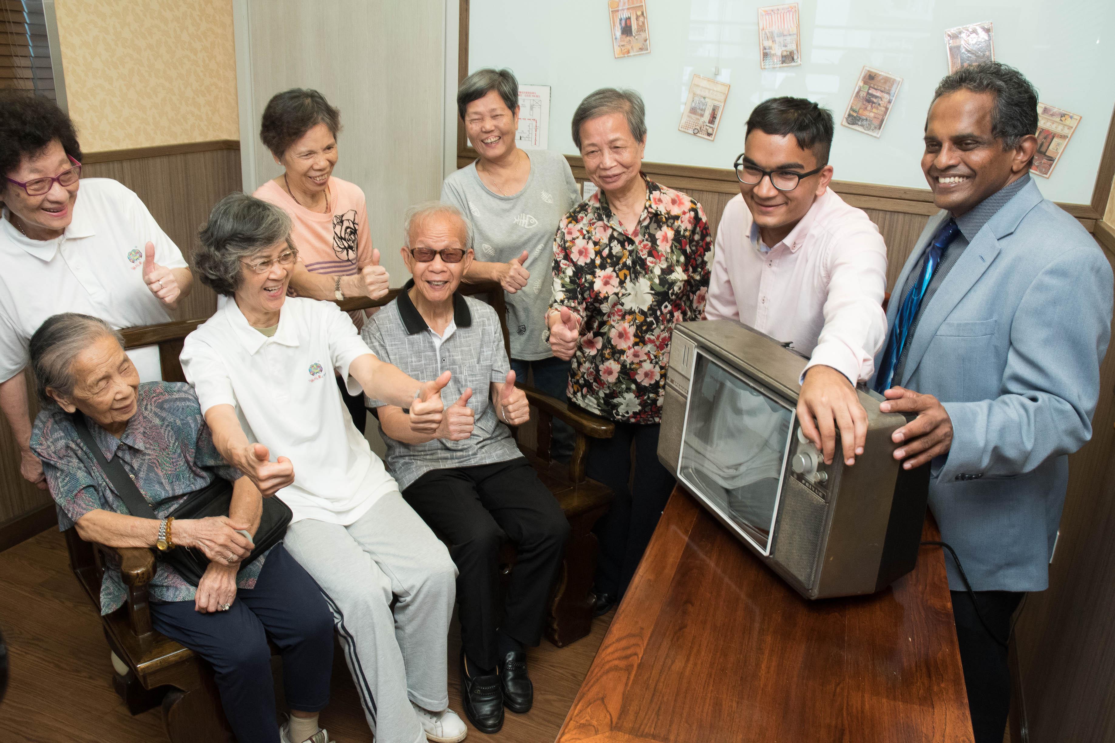 The elderly were all smiles on catching the sounds and images of their past.