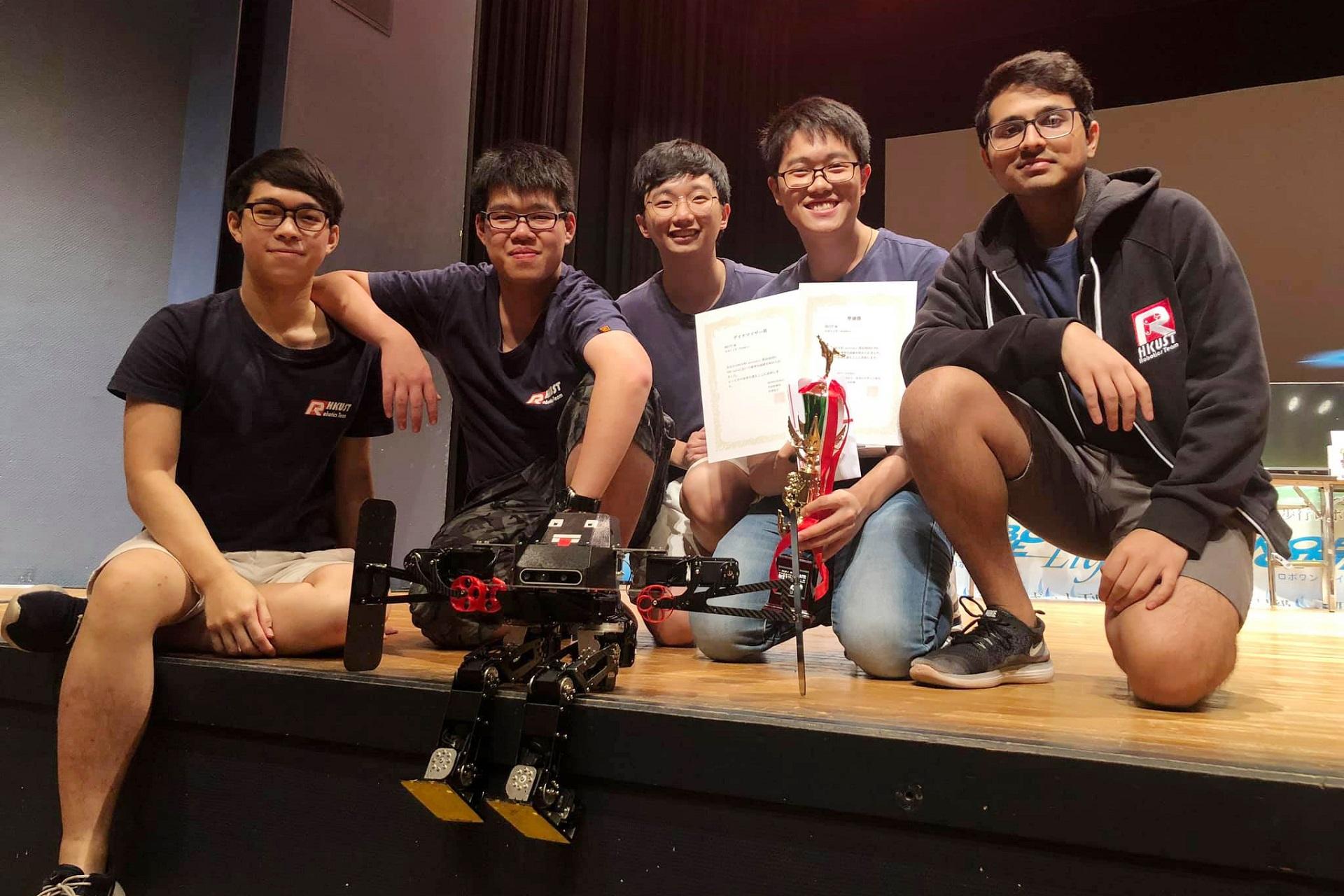 The winning team: (from left) Mak Ka-Hei, Leung Pok-Man, Mak Kin-Wing, Lee Chun-Hei and Amrutavarsh Sanganabasappa Kinagi, with their autonomous biped robot in front.