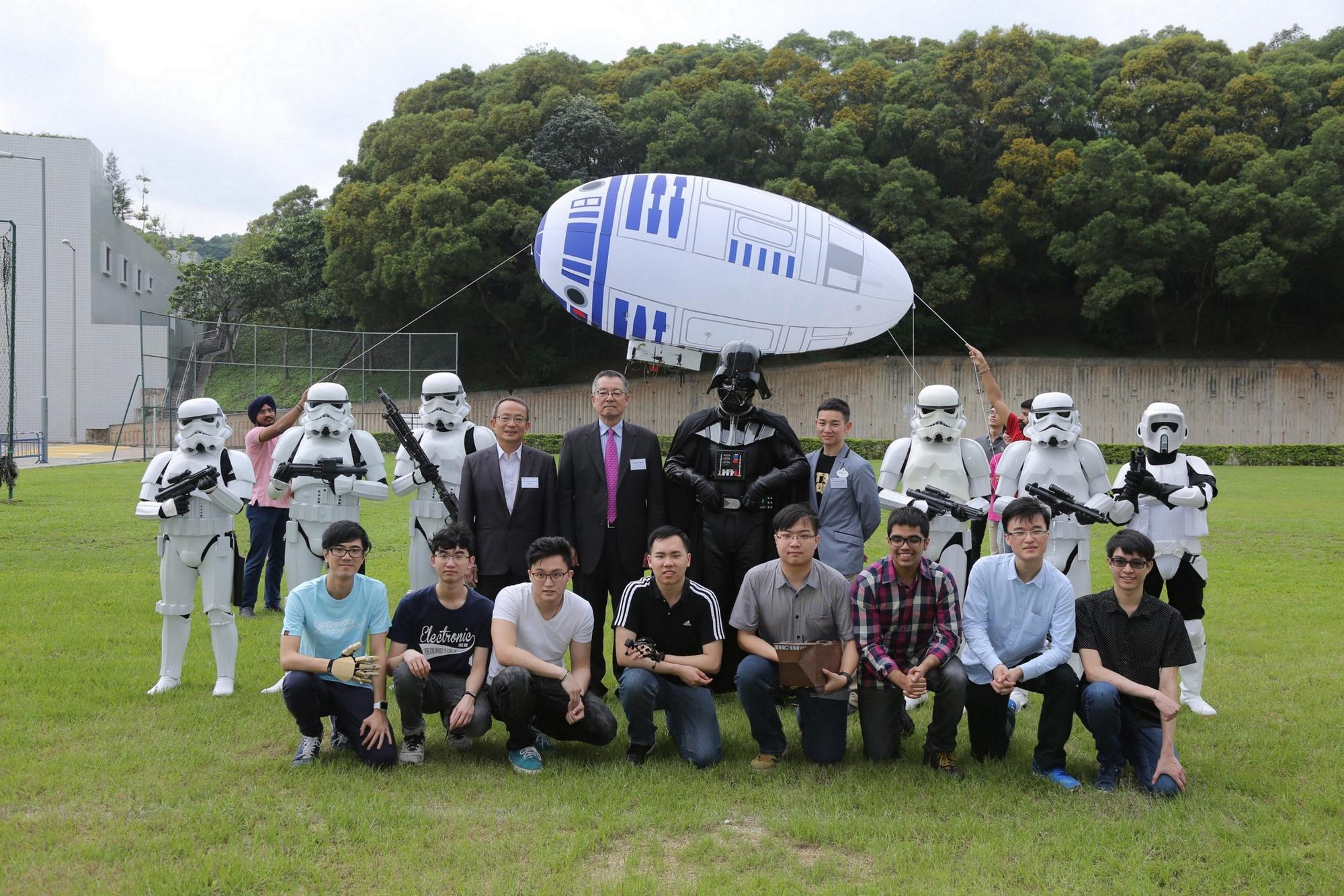 Group Photo of Disney-HKUST Grant Project Event 2nd row in the group photo (from left to right) i.) Prof Tim Kwang Ting Cheng, Dean of Engineering, Chair Professor of Electronic & Computer Engineering and Computer Science & Engineering, HKUST ii.) Dr Eden Y Woon, Vice-President for Institutional Advancement, HKUST iii.) Darth Vader iv) Mr Marcus Wong, Director, Corporate Citizenship, The Walt Disney Company Hong Kong.