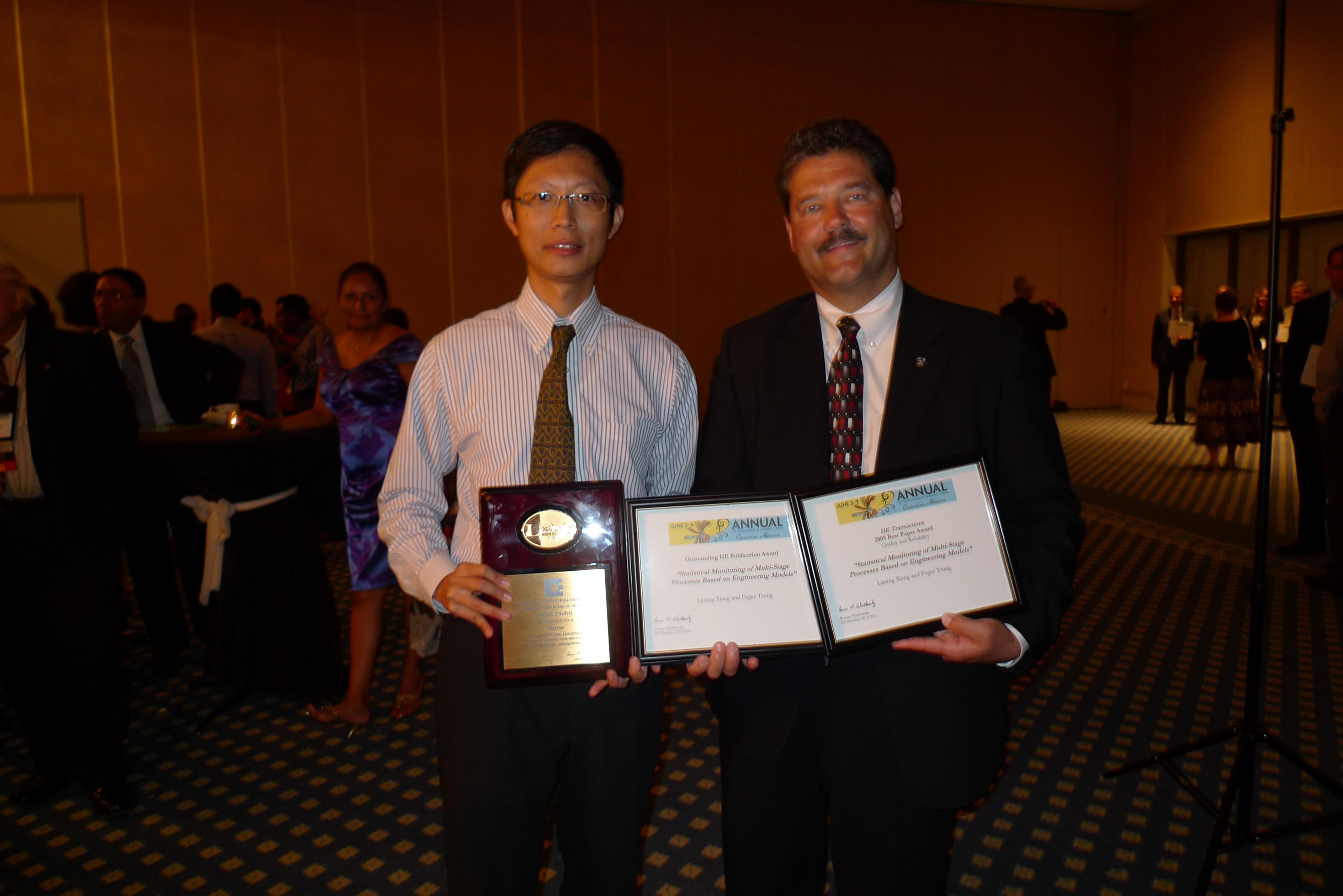 Prof Fugee Tsung (left) with the certificates of the three prestigious awards and Dr Lincoln Forbes, President of IIE, at the Industrial Engineering Research Conference in Cancun, Mexico