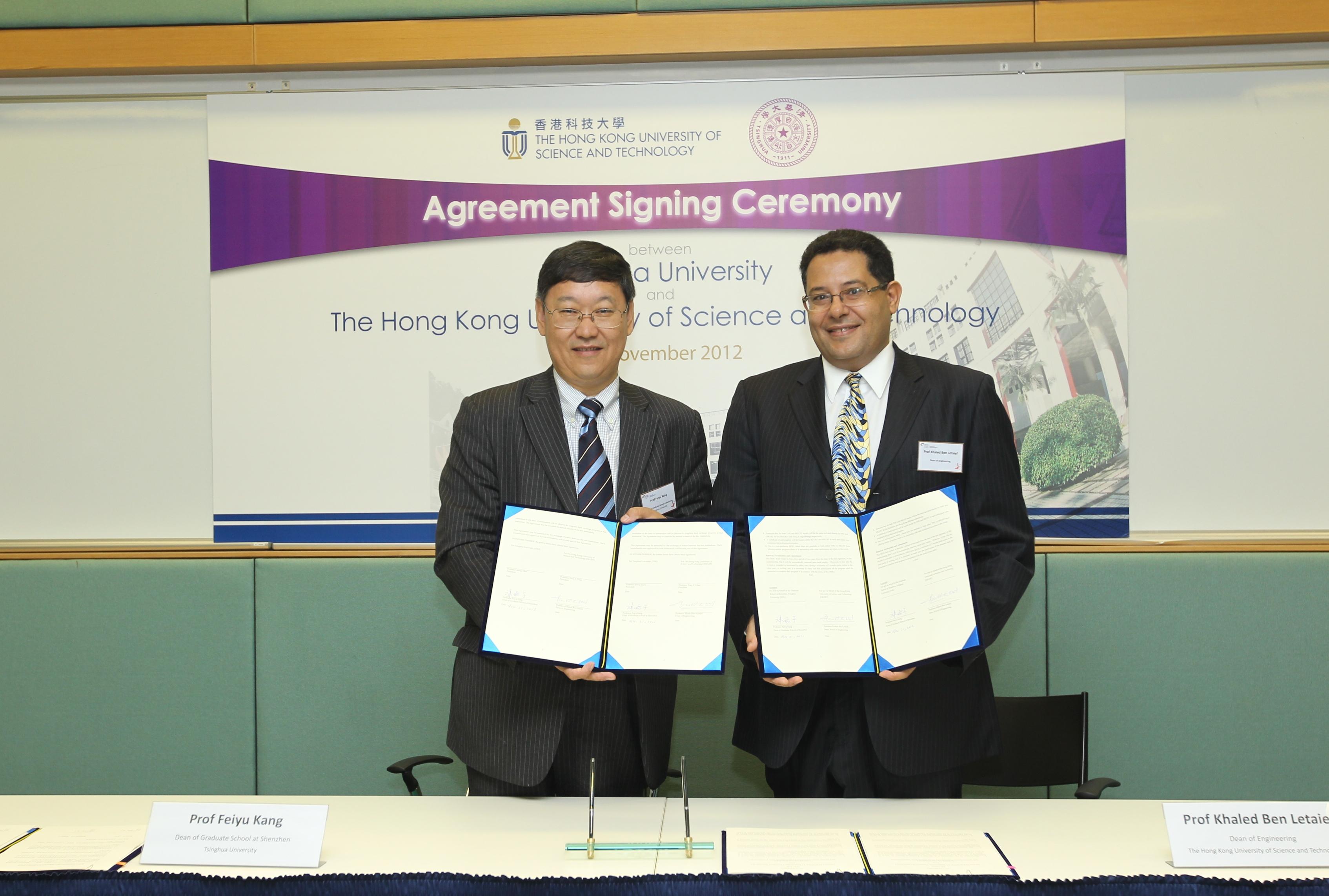 HKUST Dean of Engineering Prof Khaled Ben Letaief (right) and Dean of Graduate School at Shenzhen, Tsinghua University Prof Feiyu Kang sign the agreement at HKUST. 