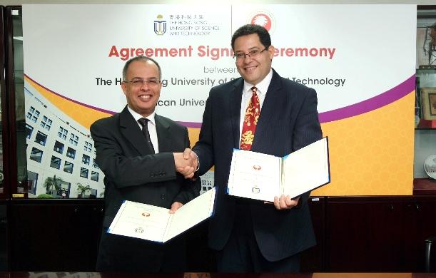 HKUST Dean of Engineering Prof Khaled Ben Letaief and AURAK Vice Chancellor Prof Hassan Al Alkim sign the memorandum at HKUST campus.