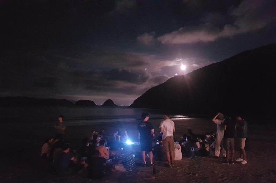 A shinny moon was up in a clear sky without light pollution