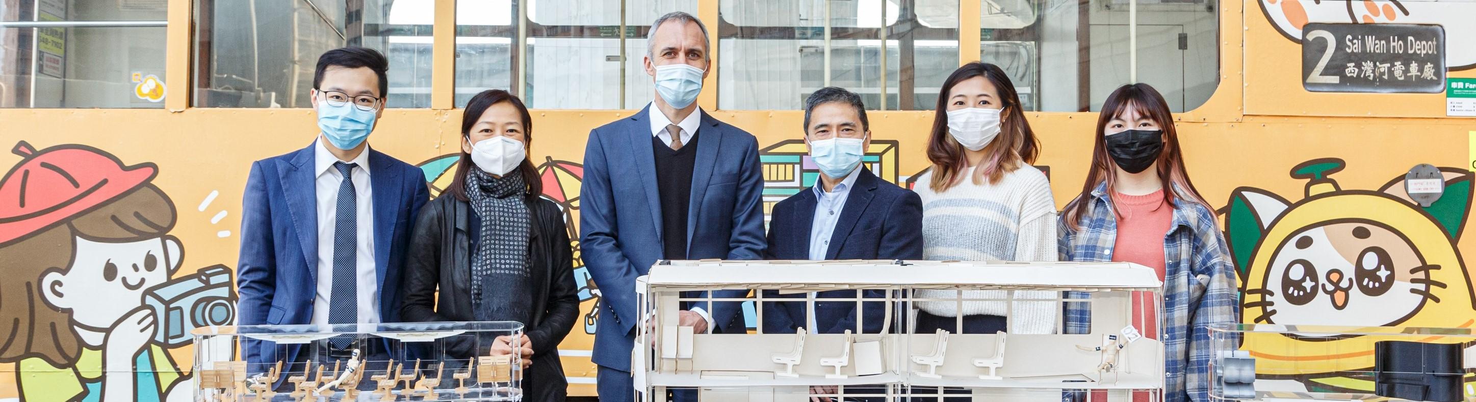 Prof. Tsui Chi-Ying, Head of HKUST Division of Integrative Systems and Design (third right), Dr. Luisa Mok Sze-Man, Lecturer of HKUST Division of Integrative Systems and Design (second left), Mr. Cyril Aubin, Managing Director of Hong Kong Tramways (third left), Mr. Nixon Cheung, Head of Commercial and Brand of Hong Kong Tramways (first left), and Year 2 students of Integrative Systems and Design Katie Chong (second right) and Jasmine Li (first right)