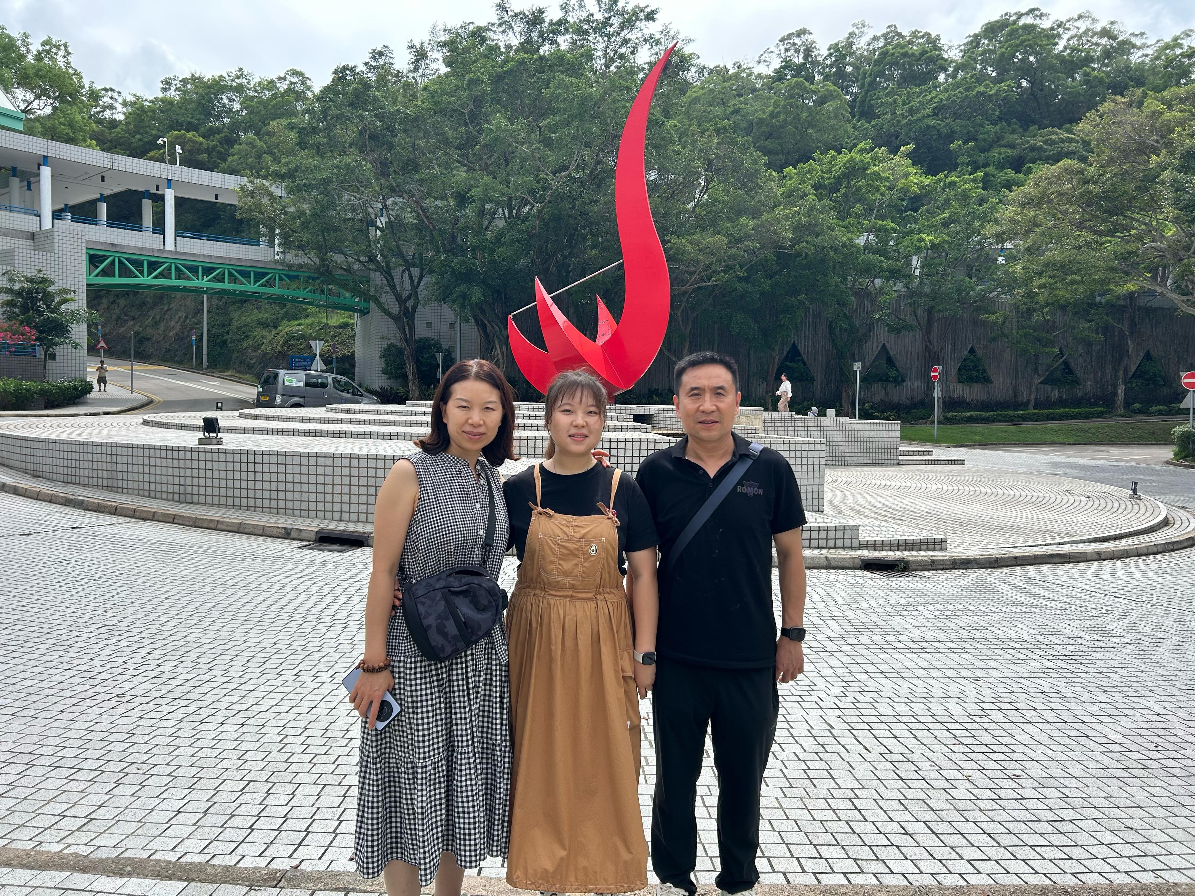 Pictured with her parents, Electronic and Computer Engineering PhD student Sarah Feng Shuo (center) has been enamored with electronics since childhood and is now determined to pursue her passion for integrated circuit (IC) design.