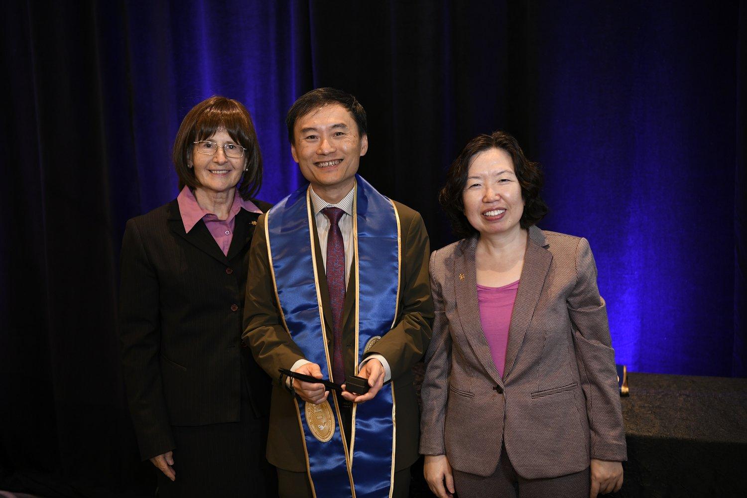 Prof. Gary Chan Shueng-Han (center) was elected as a Sigma Xi Fellow in the 2023 cohort for his contributions to enterprises through scientific research.