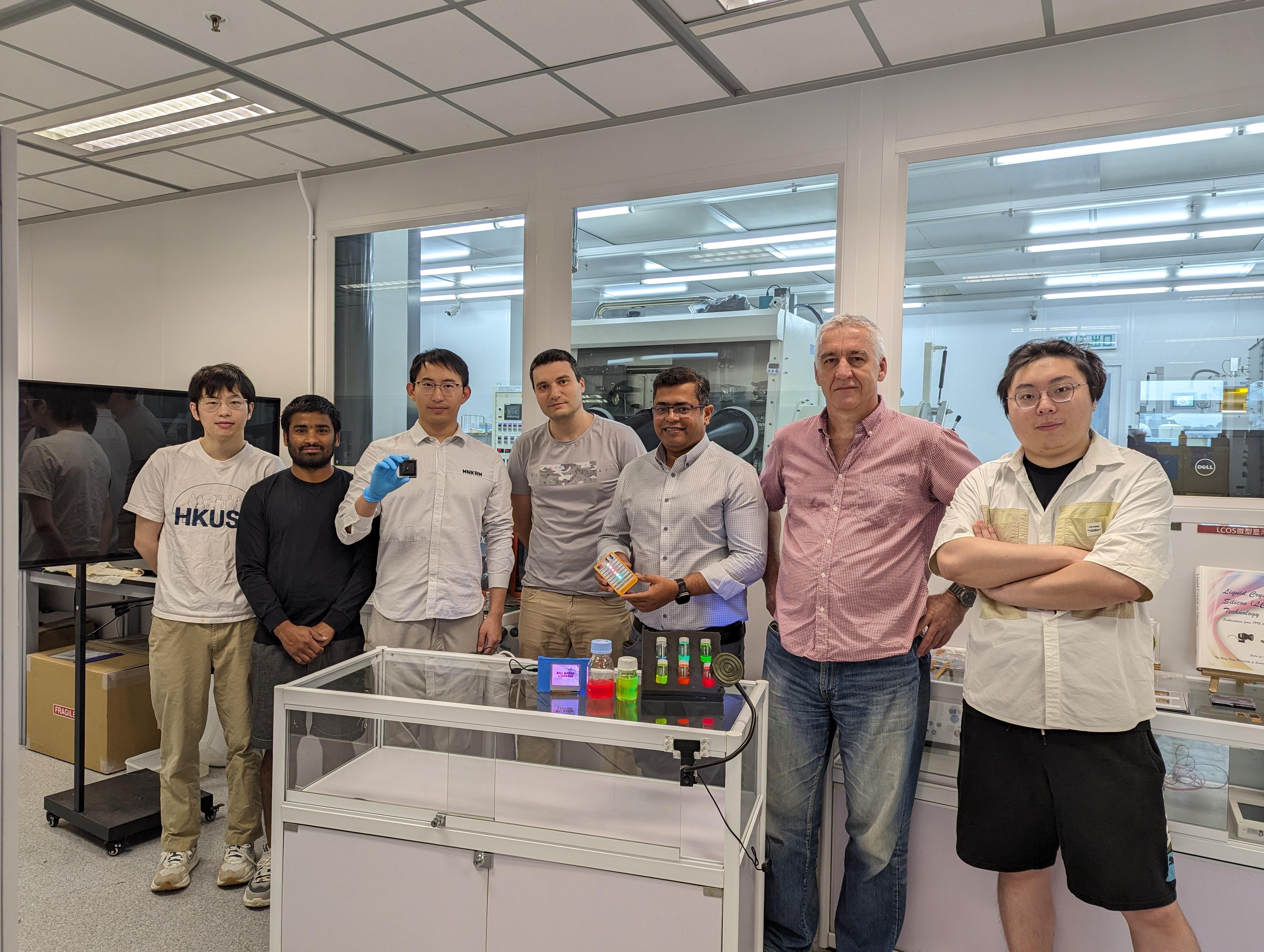 Dr. Kang Chengbin (3rd left) is holding a white LED and Prof. Abhishek Srivastava (3rd right) with a set of QRLED prototypes in his hand and various monochromatic quantum rods on the table. Other co-authors are Liao Zebing (1st left), Kumar Mallem (2nd left), Dr. Maksym Prodanov (center), Dr. Valerii Vashchenko (2nd right) and Song Jianxin (1st right).